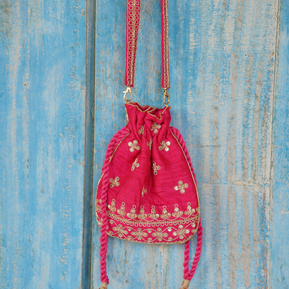 
                      
                        Rani Two Way Sling Potli
                      
                    